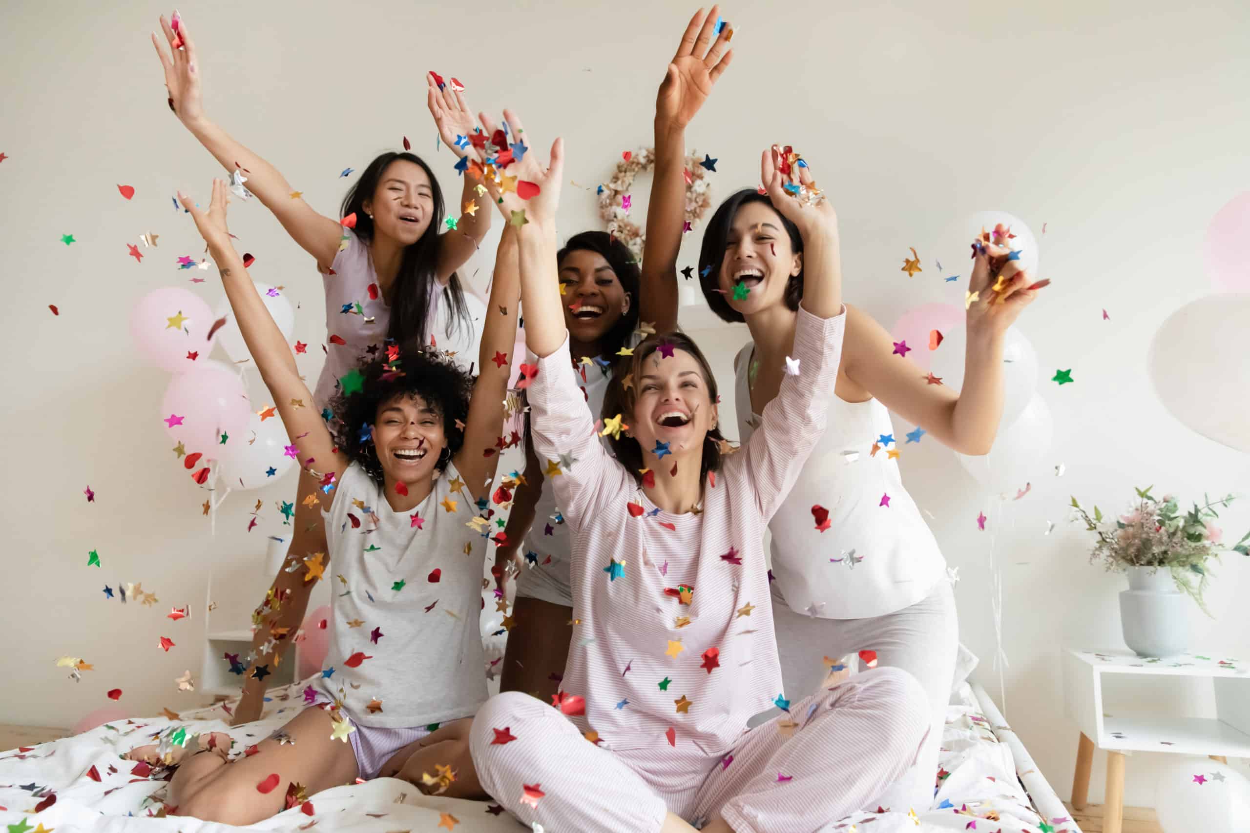 group of women throwing confetti at their Botox party