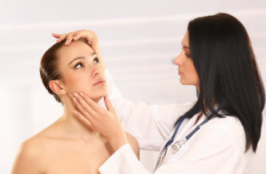 Doctor inspecting patients glowing face