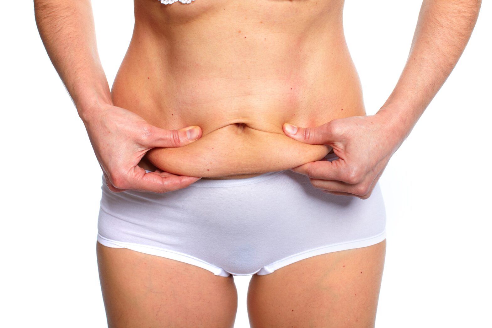woman squeezing stomach fat